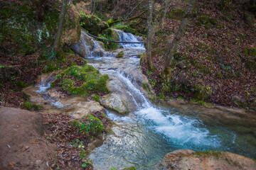 Beautiful forest waterfall, autumn day. Gostilje waterfall at mountain Zlatibor, Serbia.