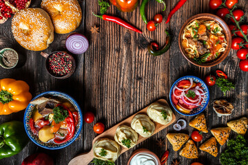 Uzbek and Central Asia cuisine concept. Assorted Uzbek food pilaf samsa lagman manti shurpa Uzbek restaurant concept Uzbek food. Food recipe background.