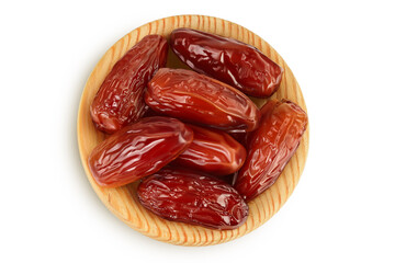 Dates in wooden bowl isolated on white background with clipping path. Top view. Flat lay