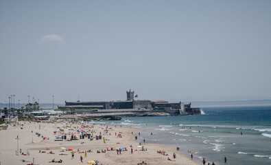 High Angle View Of People Enjoying At Praia De Carcavelos Beach