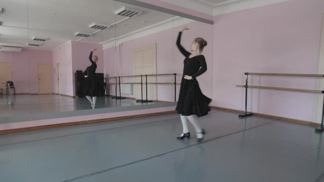 Beautiful Young Ballerinas performing folk dance. practice