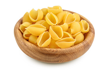 Uncooked dried conchiglie in wooden bowl. Raw organic shell pasta isolated on white bachground with clipping path and full depth of field