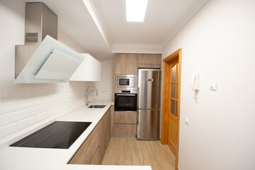 modern kitchen perfectly equipped with its appliances in a house