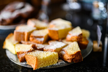 Slices of pandoro, typical italian dish, on a buffet in a luxury hotel