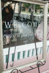 Glass Welcome Sign Additional decoration to a wedding ceremony or reception The sign reads “WELCOME We're so glad you are here