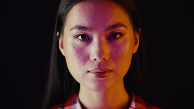 Unedited Shot Of Young Asian Female Face Looking At Camera
