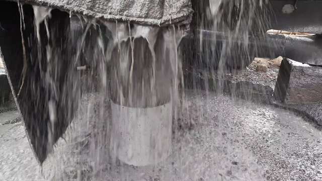 A Close Up Shot Of Water Is Coming Out Of The Casing Pipe During The Digging Of The Borewell By Borewell Machine.