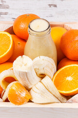 Freshly blended coctail or smoothie from citrus fruits. Healthy dessert as source vitamins and minerals