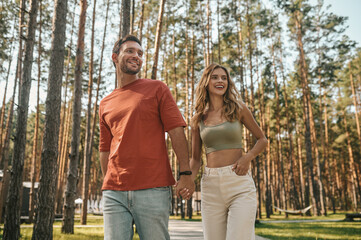 Fototapeta premium Young couple spending time together in the park