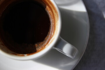 Cup of coffee in the light with beautiful pattern