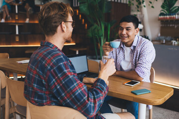 Multiracial business men working in office space