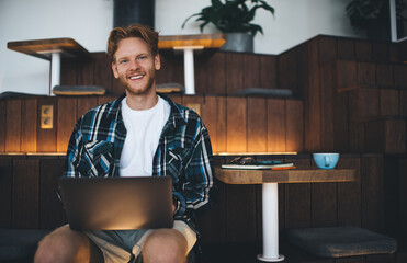 Guy using laptop in coworking office space