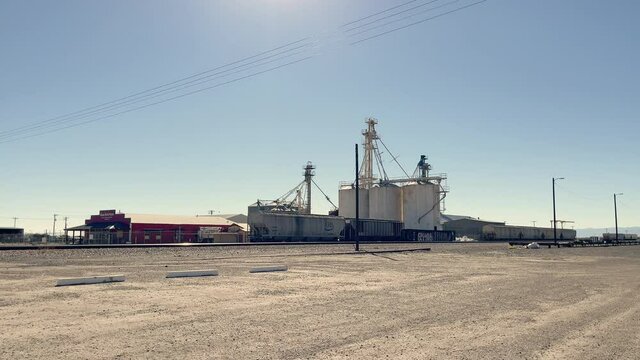 Grain Silos Next to Railroad Tracks in Willcox, Arizona. Panning shot