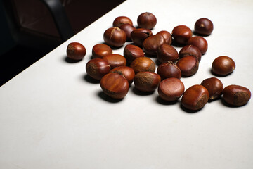 chestnuts on a white office table 