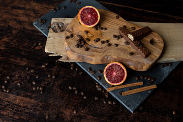 Blood orange slices with chocolate wafer.