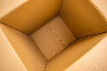 Open empty brown cardboard box background top view