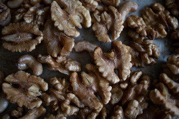 roasted walnuts on a baking sheet. Homemade preparations, protein, healthy nuts. Walnut kernels