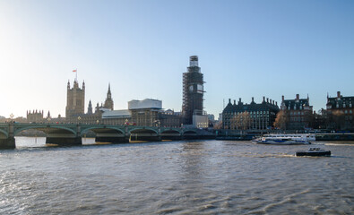 River Thames, with Westminster Bridge, famous Big Ben (Great Bell) during renovation and Palace of Westminster (Houses of Parliament) in London, England, United Kingdom.