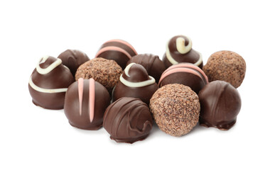 Many different delicious chocolate truffles on white background