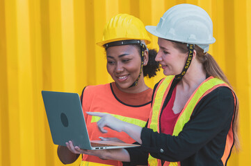 Team worker American women Work in an international shipping yard area Export and import delivery service with containers