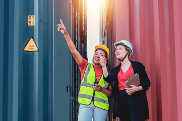 Team worker American women Work in an international shipping yard area Export and import delivery...