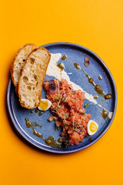 beef tartar with eggs and bread. menu concept.