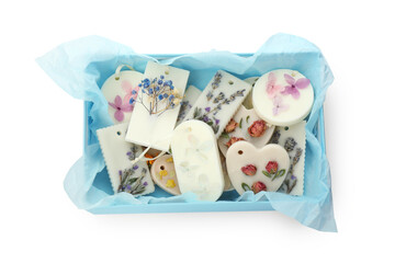Beautiful scented sachets in box on white background, top view