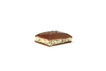 White in black porous chocolate on white background.