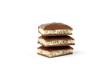 White in black porous chocolate on white background.