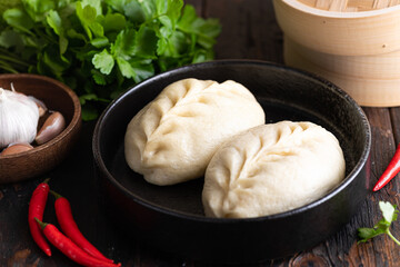 Traditional Korean steamed pie with vegetable and meat, pyanse, selective focus