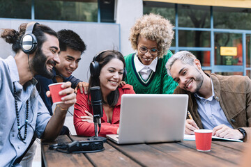 Creative coworker professional team of friends on online video call with laptop, microphone and digital tech