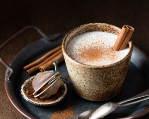 Turkish traditional hot drink salep on wooden background, selective focus