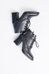 Women's boots with black genuine leather on heels isolated on a white background. photo from the...