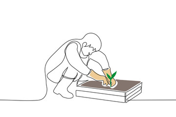 man squatting in front of box of earth and digging green seedling - one line drawing vector. home garden concept, transplant seedlings, plant plant - obrazy, fototapety, plakaty