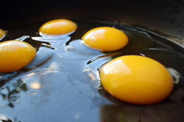 Eggs on an old skillet close-up. Fast food