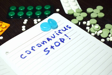 Notepad with the inscription - coronavirus Stop, covid 19 Stop