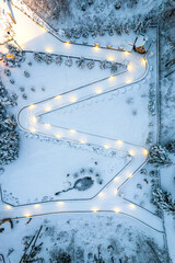 Winter Fairtale Garden Under Snow at Evening