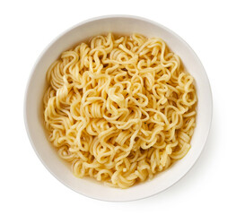Instant noodles in a plate on a white background. Top view