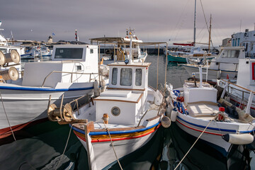 Fototapeta premium Fishing boat anchored at Naousa old harbor, Paros island Greece, Cyclades. Summer holiday