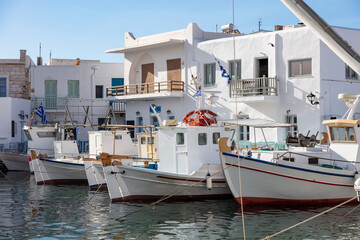 Fishing boat anchored at Naousa old harbor, Paros island Greece, Cyclades. Summer holiday