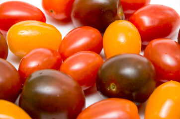Cherry tomatoes on white background