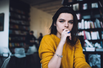 Thoughtful young woman thinking on project