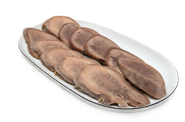 Boiled beef tongue on plate isolated on white background