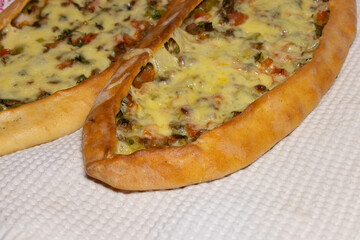 Turkish pizza - pide. Traditional pita with beef and cheddar cheese. Traditional flavors