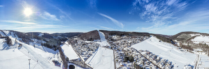 Flight over the vacation resort in Willingen in Hesse. Gastronomy and vacation houses are located...