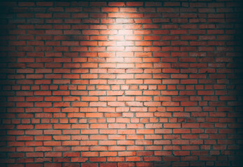 Empty space of Studio dark room black brick wall grunge texture background. Spotlight on a brick wall.