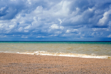 Dramatic sky with clouds over the sea coast.