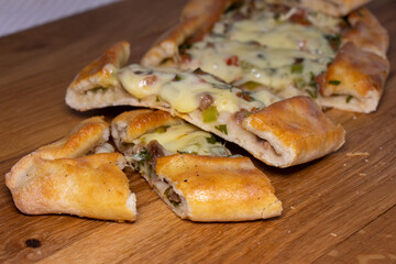 Turkish pide beef and cheese traditional pita. Turkish pide with meat cheese and vegetables on a wooden background