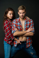 sexy man and woman embrace together in checkered shirt, relationship