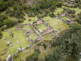 Aerial view of landscapes of Chupani village in middle of the Peruvian Andes. Small community in the Sacred Valley with some ruins and river.